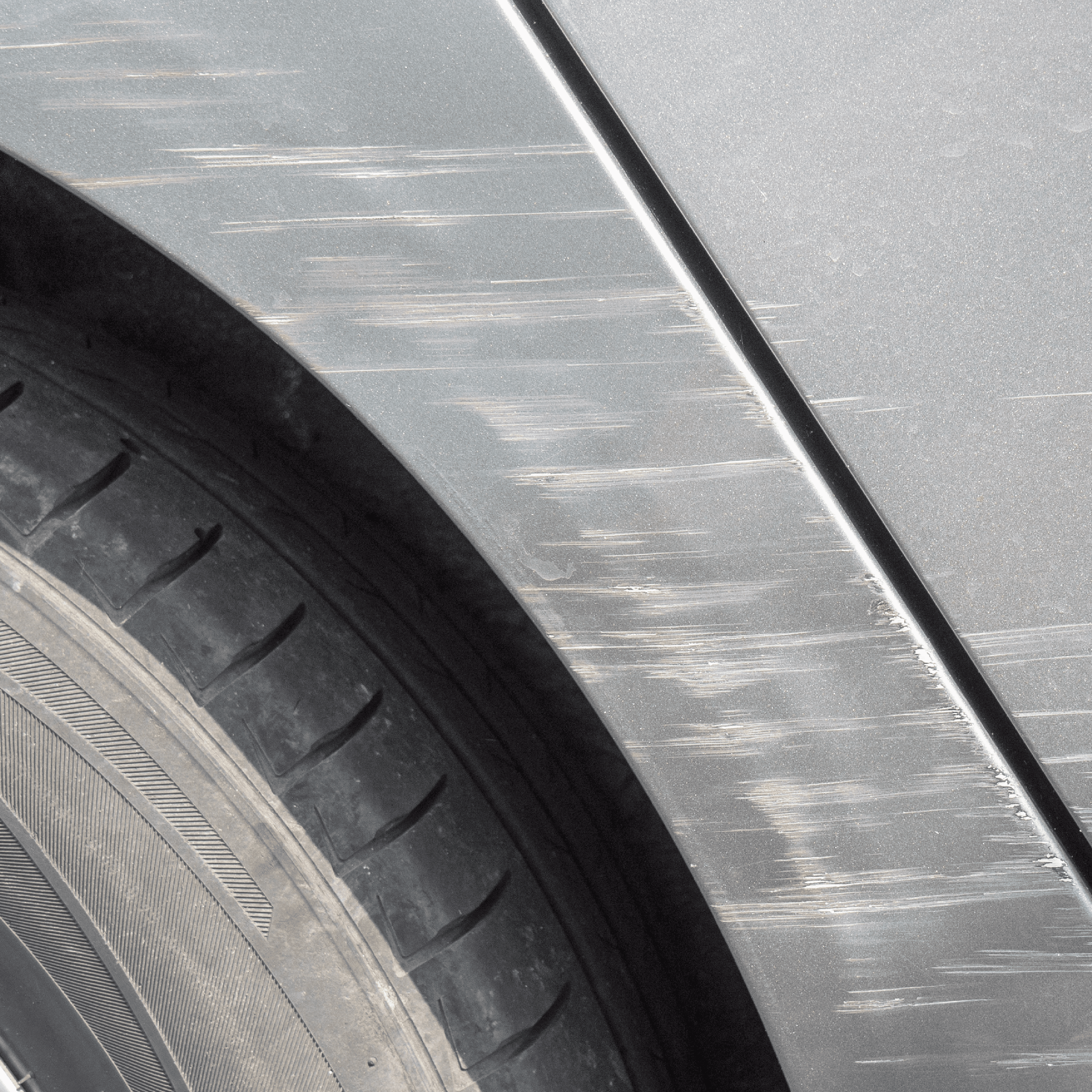 Vehicle with paint that was damaged by road debree